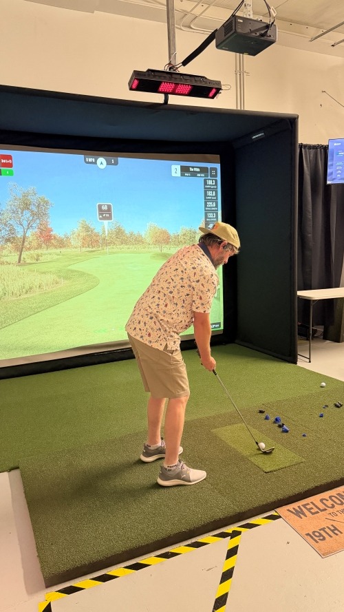 Golfer getting ready to hit at Albatross Indoor Golf in Boise, Idaho